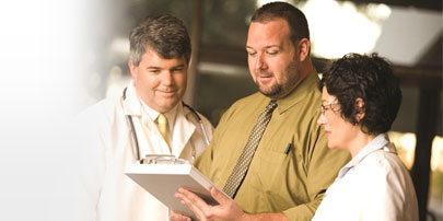 Three Doctors Reviewing Chart