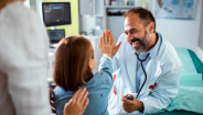 child high-fiving doctor