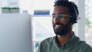 Man sitting at computer with headset