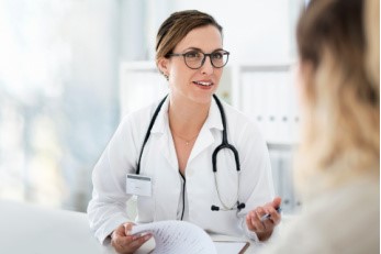 female doctor talking to patient
