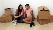 man and woman sitting with boxes