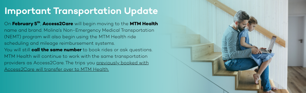 man and child looking at laptop