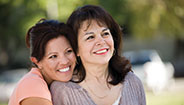 Daughter hugging mother