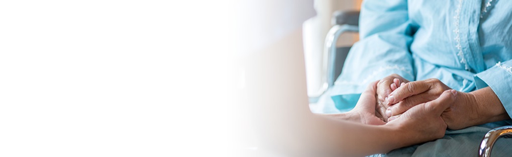 provider holding patient's hand