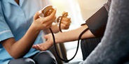 Doctor checking patient's blood pressure Doctor checking patient's blood pressure