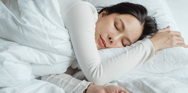 Woman sleeping on her side