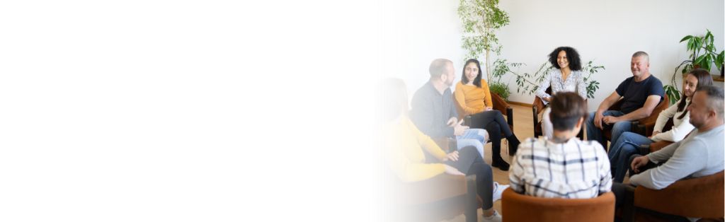 group of people sitting in a circle