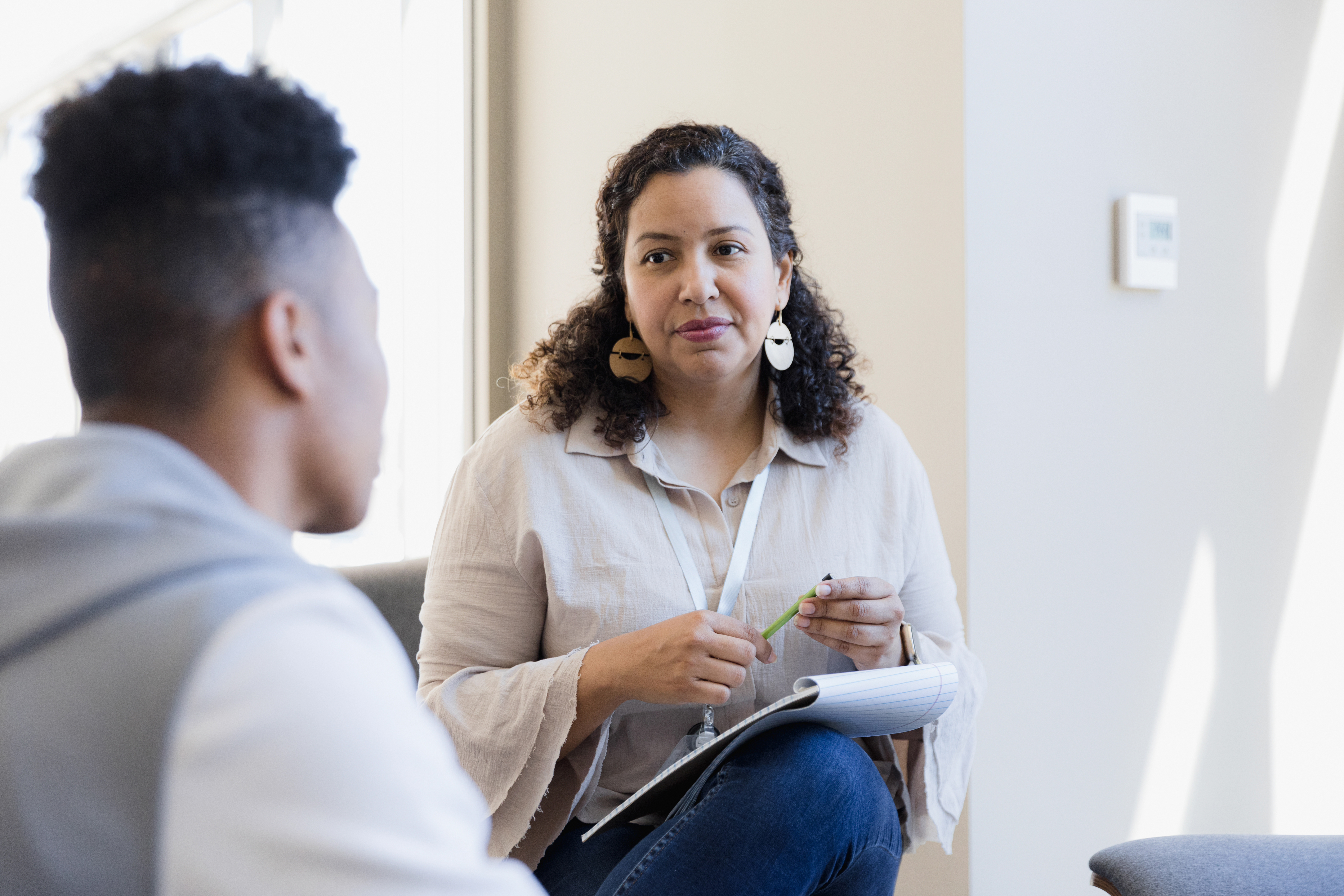 Man talking to woman