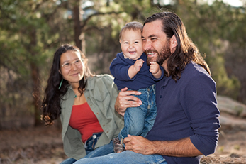 man and woman with baby