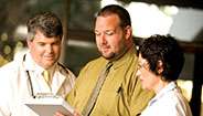 Three doctors talking