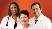 Three doctors smiling