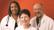 Three doctors smiling