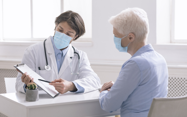 doctor showing patient a chart