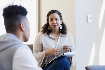 Man talking to woman