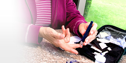 Woman testing blood glucose level