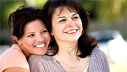 Mother and daughter smiling  