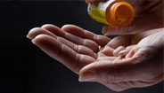 Hand holding prescription drugs