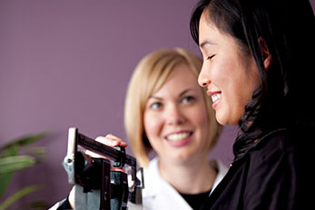 Doctor weighing girl