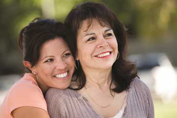Daughter hugging mother