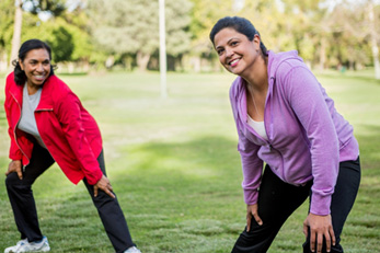 Two women stretching