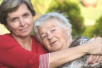 Daughter hugging mother