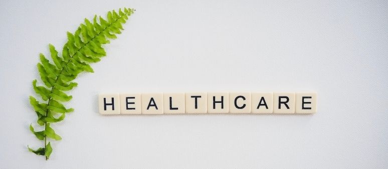 Healthcare spelled with scrabble tiles