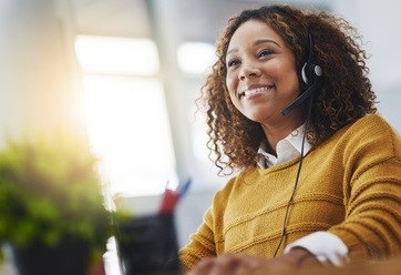 smiling woman wearing headset