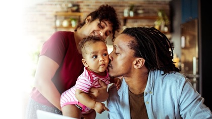 father kissing baby father kissing baby