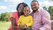 Mother, Father, and Young Son Smiling