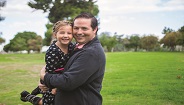 Father holding young child Father holding young child