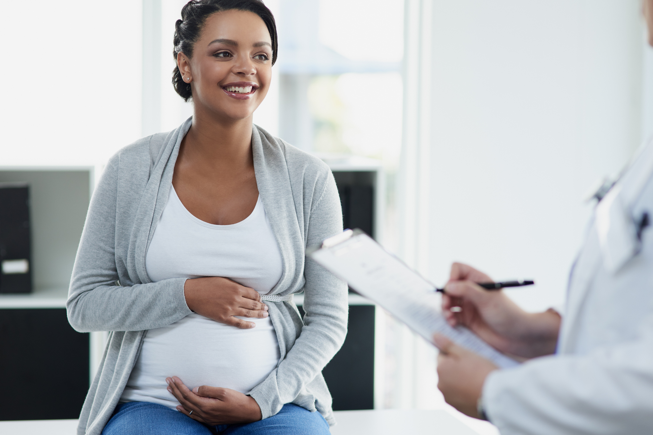 Pregnant woman at prenatal visit. Pregnant woman at prenatal visit.