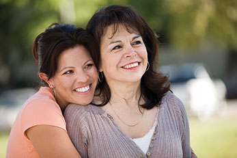 Daughter hugging mother