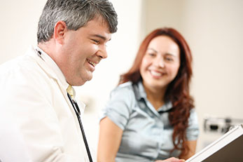 Doctor and patient smiling