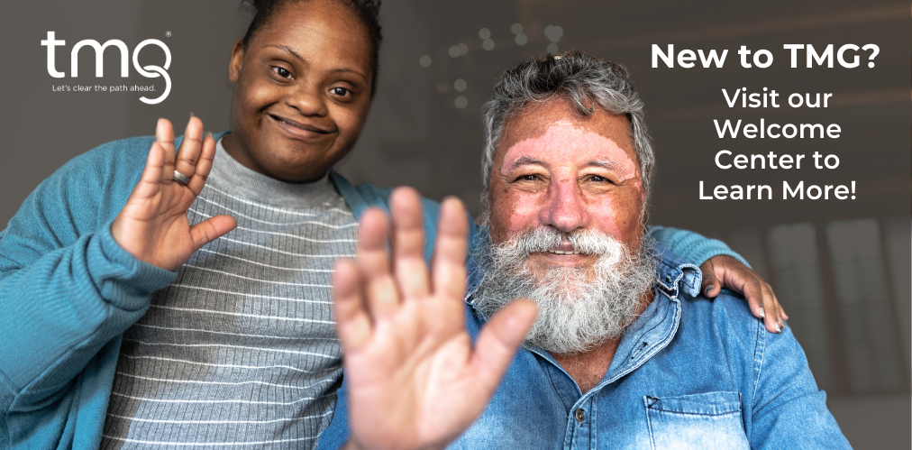TMG Banner - two people waiving